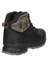 Botín masculino negro con tecnología waterproof, combina moda y funcionalidad en cualquier entorno.