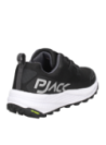 Zapatilla negra de mujer con estructura sintética y textil, diseño sin costuras visibles, ideal para largas caminatas.