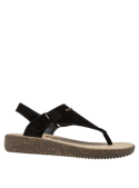 Sandalia negra de mujer en cuero, con correa de tobillo y cierre de velcro. Estilo casual y moderno.
