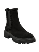Botín Chelsea negro de cuero gamuzado con borde lanoso, ideal para mujer, combina estilo urbano y diseño moderno.