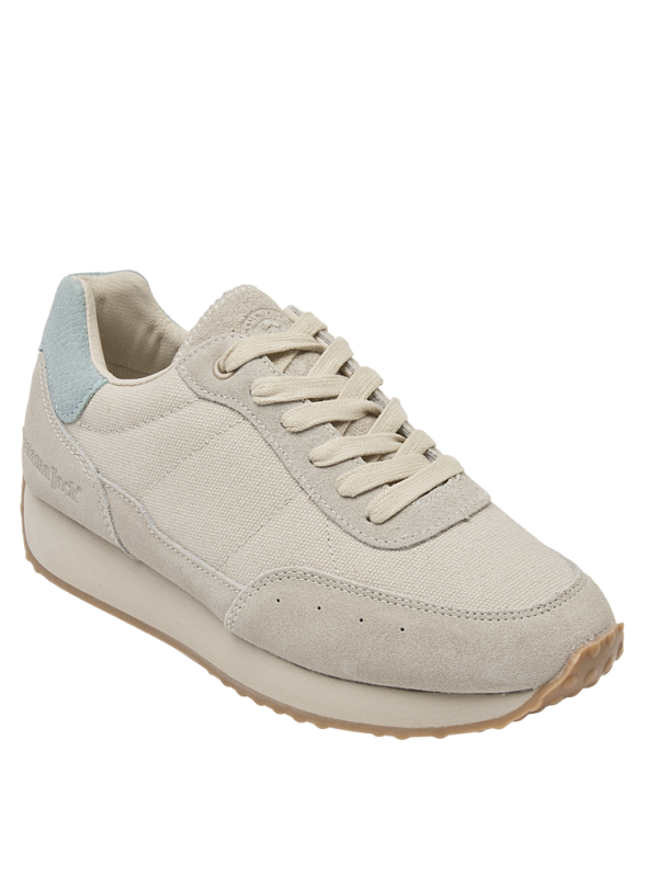 Zapatilla blanca casual de mujer en cuero y textil, ideal para actividades diarias.