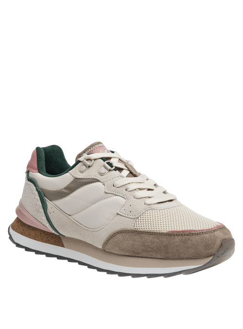 Zapatilla beige de mujer, ideal para uso prolongado, suela ligeramente levantada en el talón para pisada suave.
