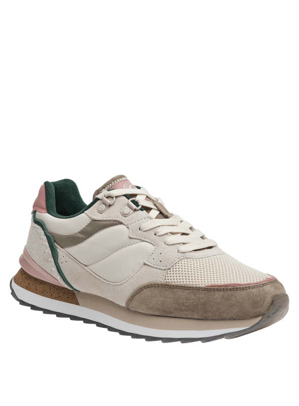 Zapatilla beige de mujer, ideal para uso prolongado, suela ligeramente levantada en el talón para pisada suave.