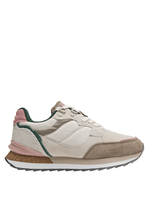 Zapatilla beige de mujer, ideal para uso prolongado, suela ligeramente levantada en el talón para pisada suave.