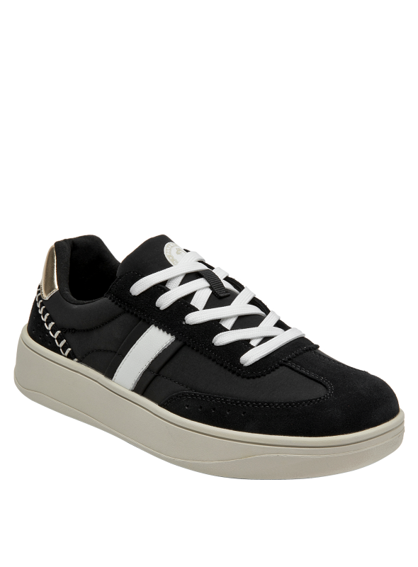 calzado de cuero negro con detalles blancos, ideal para estilo casual chic femenino