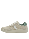 elegante zapatilla de cuero beige con diseño moderno y banda lateral contrastante