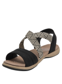 Sandalia negra de mujer con correa de zigzag blanco y negro, estilo outdoor casual.