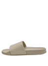 Sandalia casual beige con diseño elegante y suela plana para comodidad diaria.