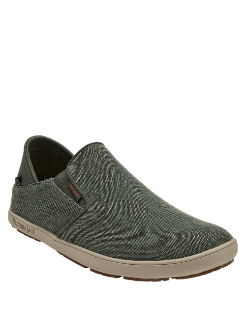 Calzado masculino urbano en gris oscuro, textil con etiqueta discreta, suela beige contrastante.