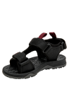 Calzado infantil negro con velcros ajustables y suela antideslizante, ideal para caminatas ligeras.