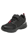 Zapatilla infantil negra con malla transpirable y suela moteada blanca, perfecta para uso urbano y deportivo.