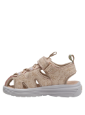 Calzado infantil beige con cierre de velcro y diseño moderno, perfecto para uso diario.