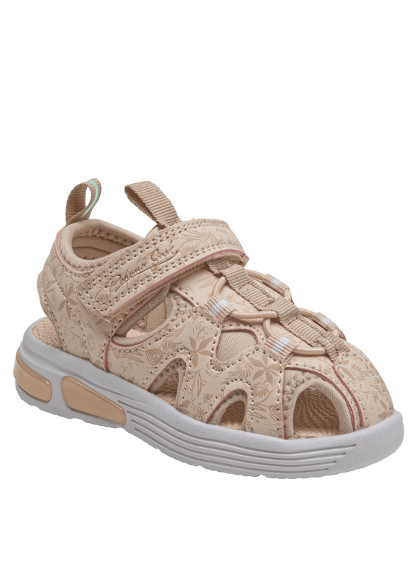 Sandalia de niña en material sintético beige, elegante y minimalista con diseño floral.
