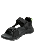 Sandalia outdoor negra con suela antiderrapante y detalle verde, ideal para caminatas.