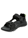 Sandalia outdoor negra con suela antiderrapante y detalle verde, ideal para caminatas.