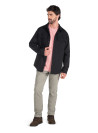 Chaqueta negra de hombre en algodón y spandex, detalle de manga larga y corte clásico.