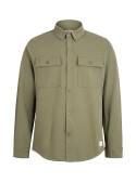 Chaqueta de algodón verde con mezcla de spandex para flexibilidad.