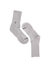 Calcetines grises unisex ajustados con elasticidad, perfectos para looks casuales y deportivos.