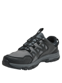 Calzado urbano gris unisex con suela ULTRACTION para agarre en superficies irregulares.