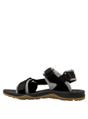 Calzado infantil negro, diseño abierto, recomendado para uso diario en plaza y sendero urbano.