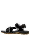 Calzado infantil negro, diseño abierto, recomendado para uso diario en plaza y sendero urbano.