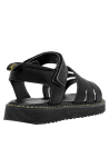 Calzado negro de niña, diseño limpio, material sintético.