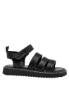 Calzado negro para niña, diseño de correas, perfecto para actividades al aire libre.