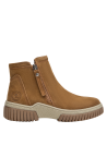 Botín de cuero para mujer en color camel, estilo casual, ideal para el uso diario.