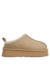 Pantuflas cómodas en color beige, recomendadas para actividades diarias y descanso en casa.