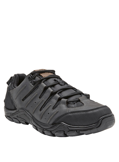 Zapatilla de cuero gris, suave y duradera, adecuada para explorar terrenos variados.