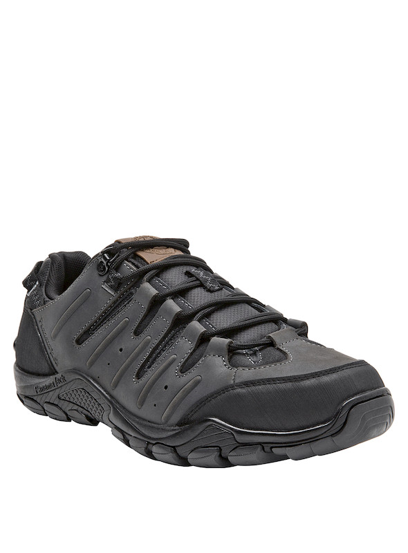 Zapatilla de cuero gris, suave y duradera, adecuada para explorar terrenos variados.